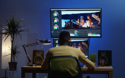 Video editor editing footage and adding transitions in professional editing software